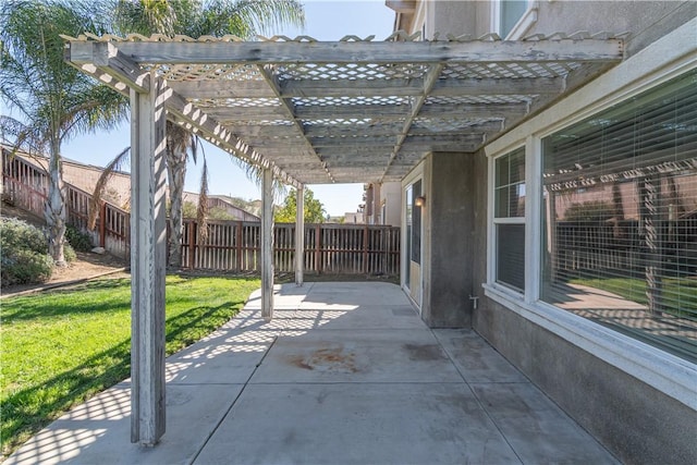 view of patio with fence and a pergola