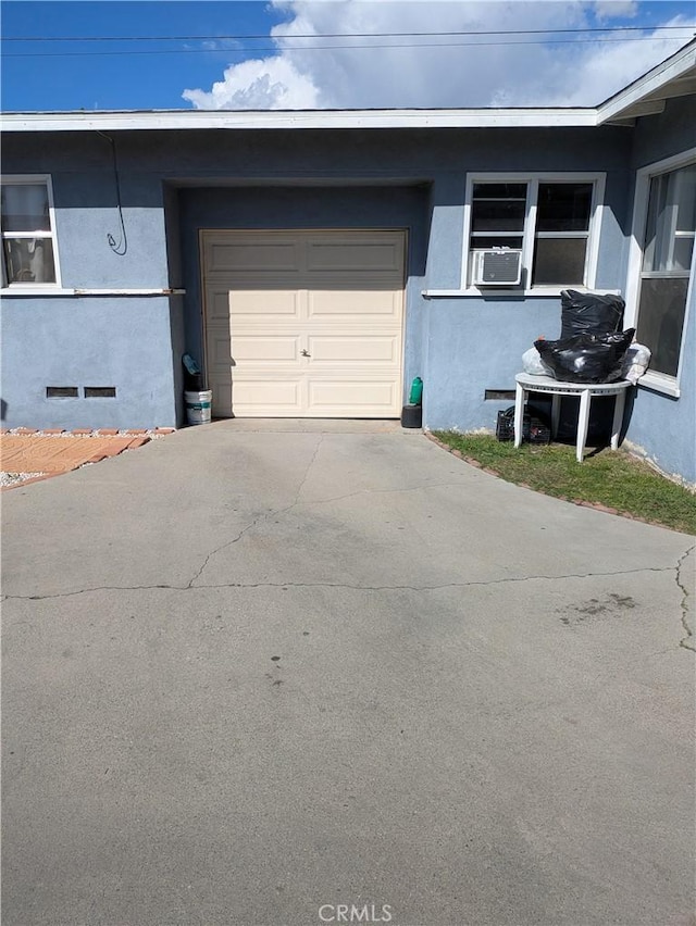 exterior space featuring cooling unit and driveway