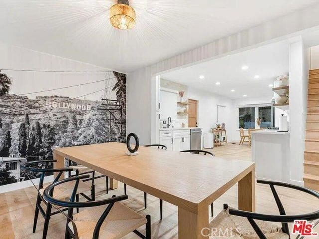 dining room with recessed lighting and light wood-style flooring