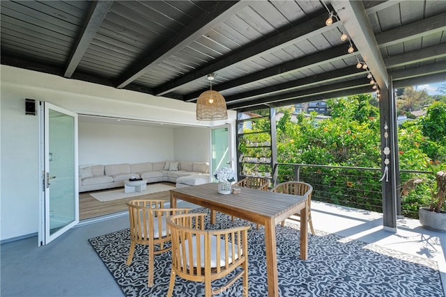 sunroom featuring beamed ceiling and wood ceiling