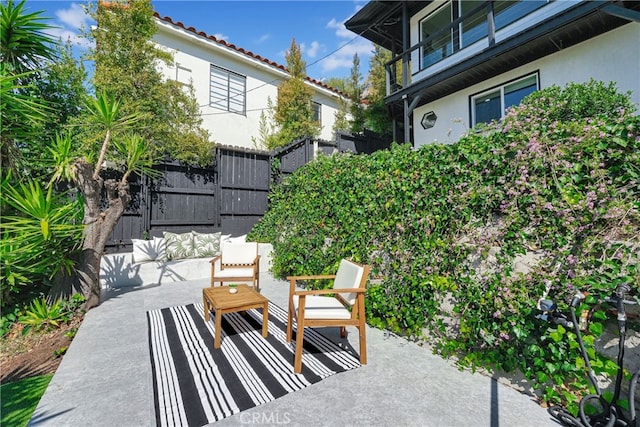 view of patio featuring fence