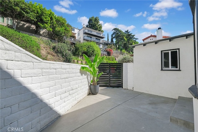 view of patio / terrace featuring fence