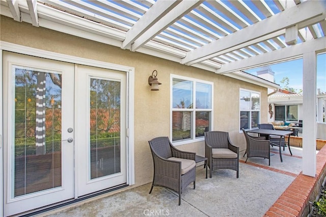 view of patio / terrace featuring a pergola and outdoor dining area