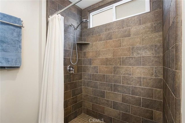 full bathroom with a shower stall