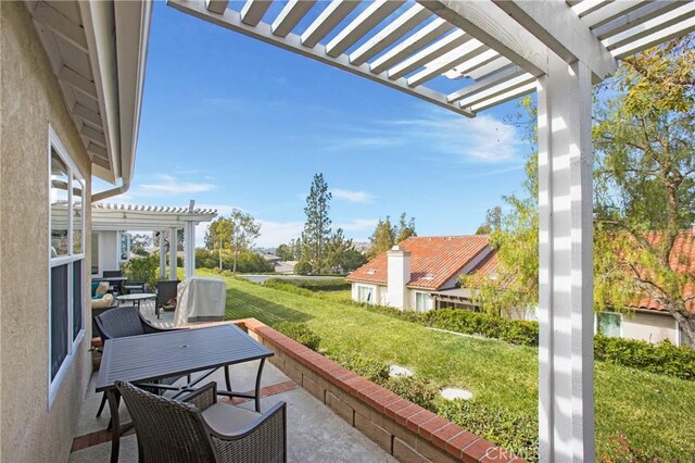 view of patio / terrace with a pergola and outdoor dining area