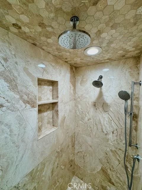 interior space featuring tiled shower