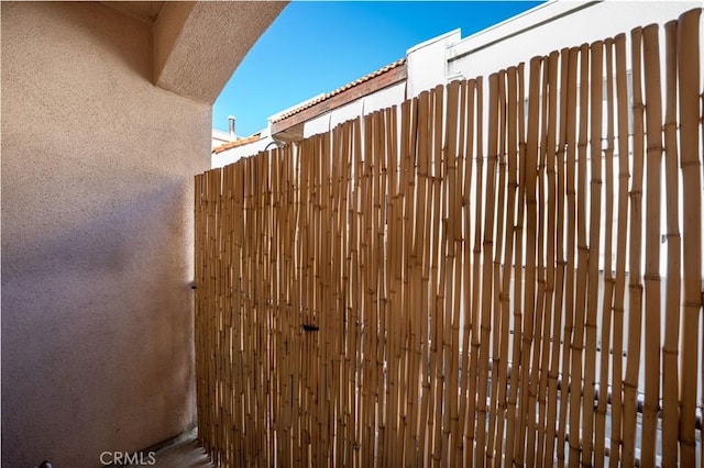 view of gate with fence