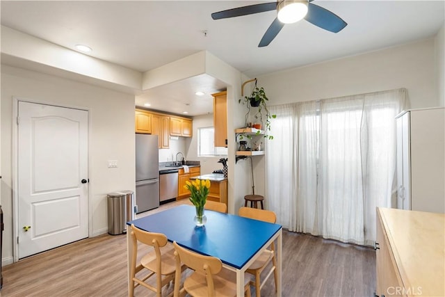 dining room featuring recessed lighting, light wood-style flooring, and a ceiling fan