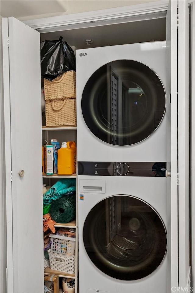 laundry area with laundry area and stacked washing maching and dryer