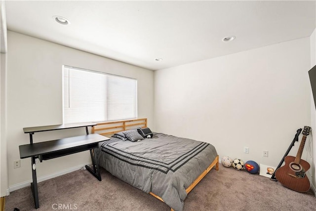 carpeted bedroom with recessed lighting