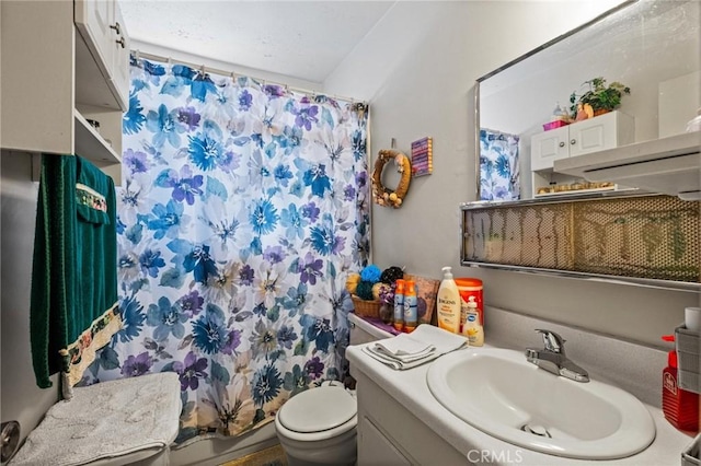 full bathroom featuring vanity and toilet