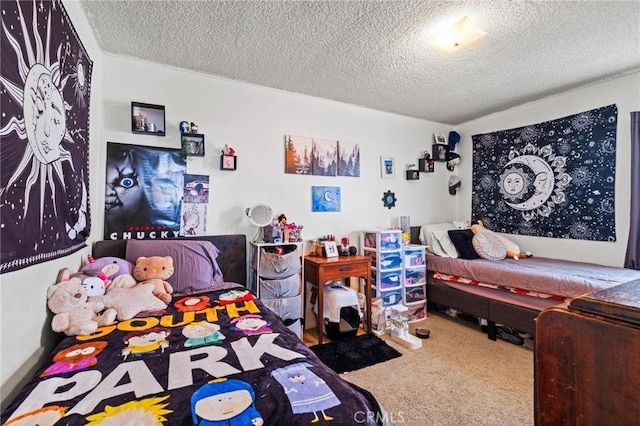 bedroom with a textured ceiling and carpet flooring