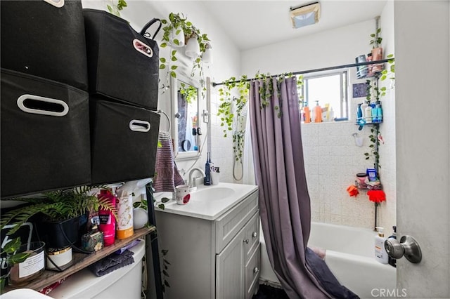 bathroom featuring toilet, shower / bath combo, and vanity