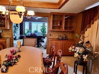 dining area featuring an inviting chandelier