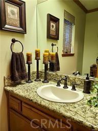 bathroom featuring vanity and crown molding