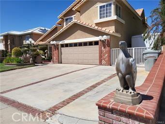 view of front of home with concrete driveway and an attached garage