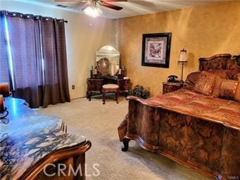 carpeted bedroom featuring a ceiling fan