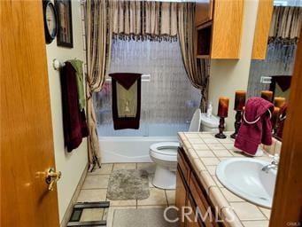 bathroom featuring vanity,  shower combination, toilet, and tile patterned flooring