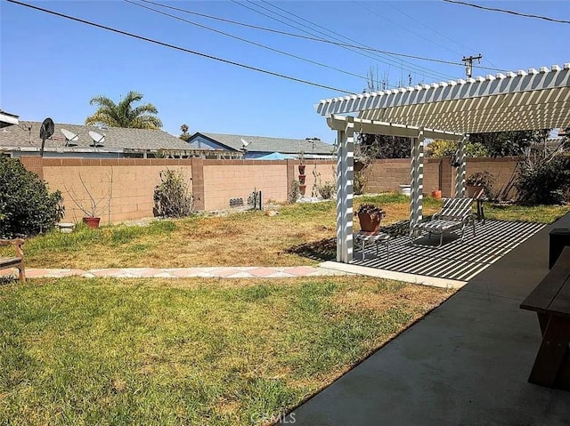 view of yard with a patio area, a fenced backyard, and a pergola