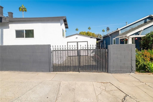 view of gate featuring fence