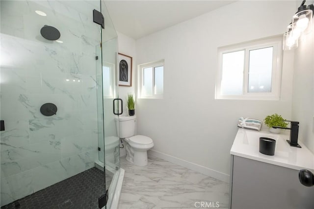 full bathroom with a marble finish shower, baseboards, toilet, marble finish floor, and vanity