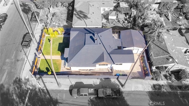 birds eye view of property with a residential view