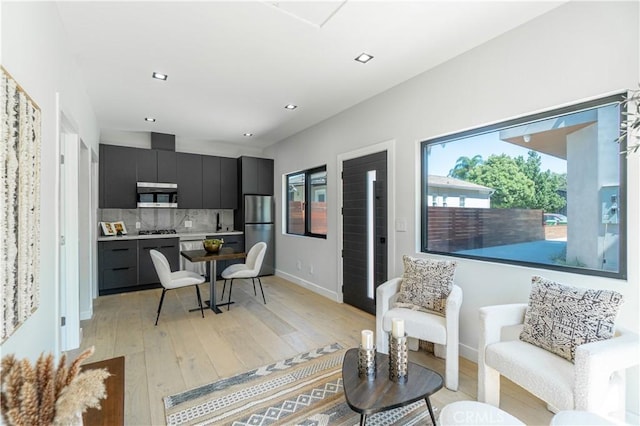 10943 Pickford Way, Culver City, CA 90230 - living room with recessed lighting, baseboards, and light wood-style floors