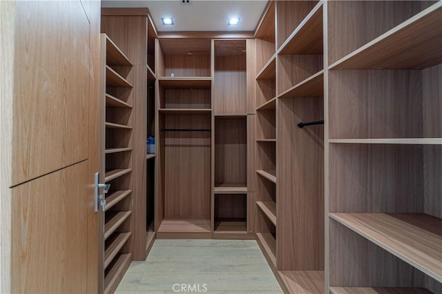 10943 Pickford Way, Culver City, CA 90230 - walk in closet with light wood-type flooring