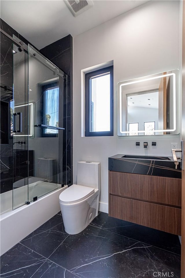 10943 Pickford Way, Culver City, CA 90230 - full bathroom featuring visible vents, vanity, toilet, marble finish floor, and enclosed tub / shower combo