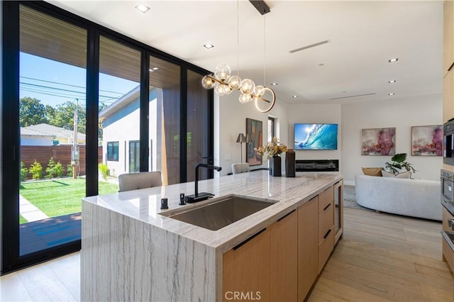 10943 Pickford Way, Culver City, CA 90230 - kitchen with a sink, modern cabinets, a wealth of natural light, and open floor plan