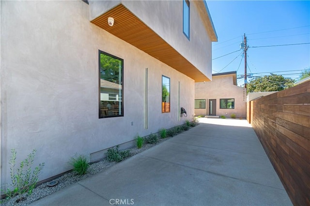 10943 Pickford Way, Culver City, CA 90230 - view of property exterior featuring fence, a patio, and stucco siding