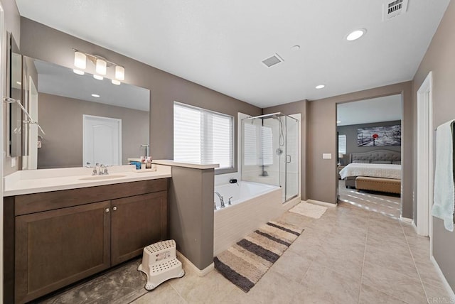 ensuite bathroom featuring vanity, visible vents, a shower stall, ensuite bathroom, and a bath