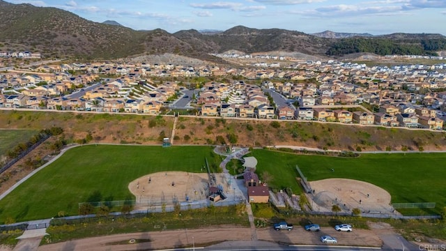 aerial view featuring a mountain view and a residential view