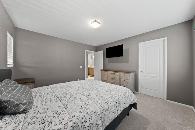 bedroom featuring baseboards and light carpet