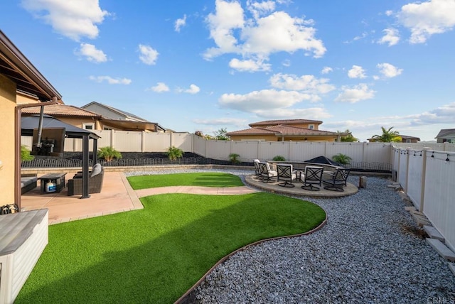 view of yard with a fenced backyard and a patio