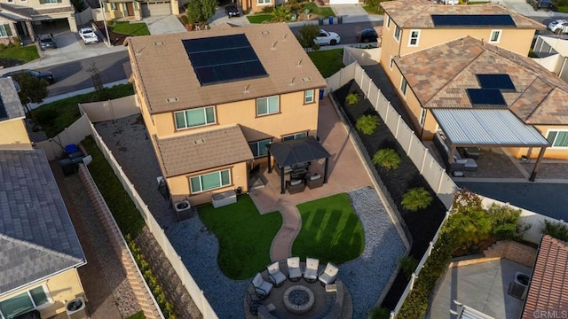 birds eye view of property with a residential view