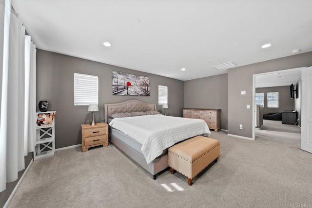 carpeted bedroom featuring visible vents, recessed lighting, and baseboards