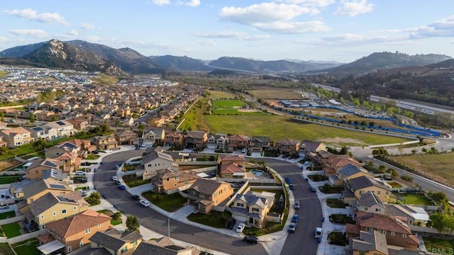 birds eye view of property featuring a mountain view and a residential view