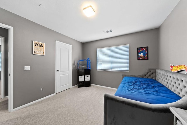 bedroom featuring visible vents, baseboards, and carpet flooring