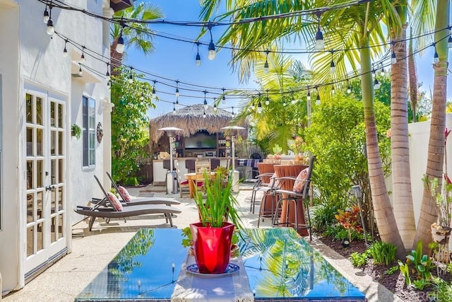 view of patio / terrace with french doors and fence