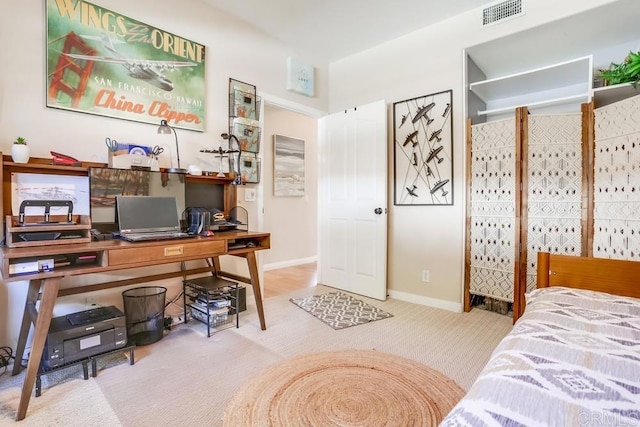 bedroom featuring visible vents and baseboards