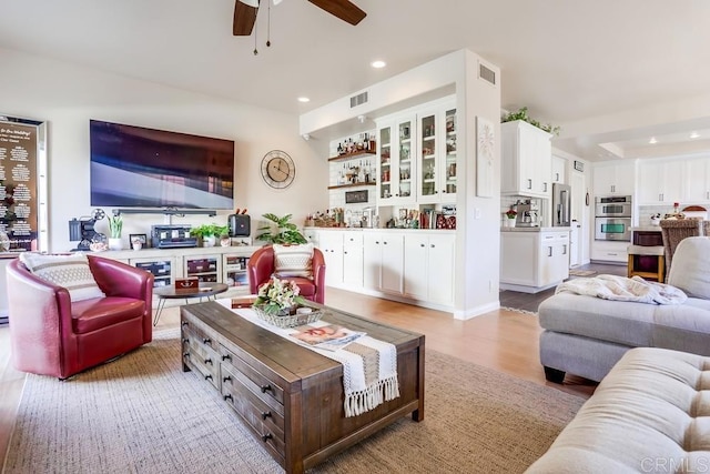 living room featuring visible vents, recessed lighting, a ceiling fan, and light wood-style floors