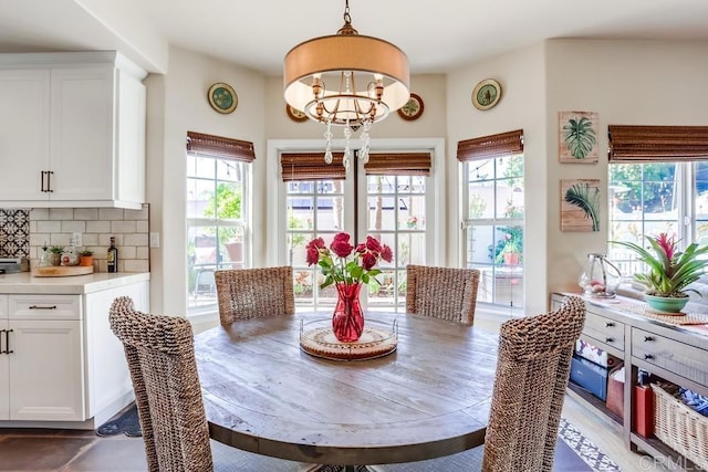 dining space with an inviting chandelier