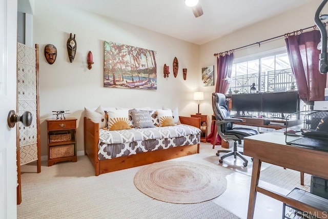 carpeted bedroom with a ceiling fan