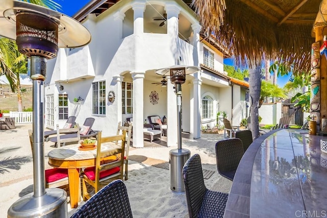 view of patio / terrace with outdoor dining space and a ceiling fan