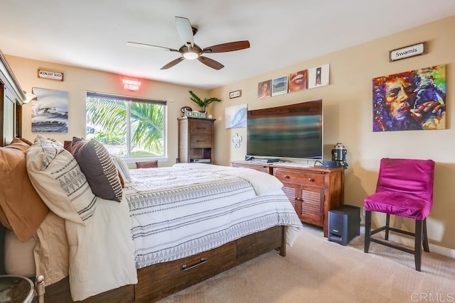 carpeted bedroom featuring baseboards and ceiling fan