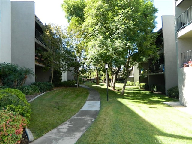 view of home's community featuring a lawn