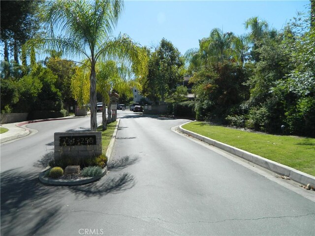 view of street featuring curbs