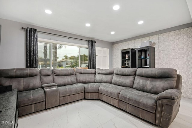 living room with recessed lighting and marble finish floor