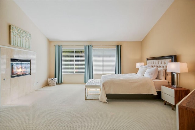 bedroom featuring carpet floors and vaulted ceiling